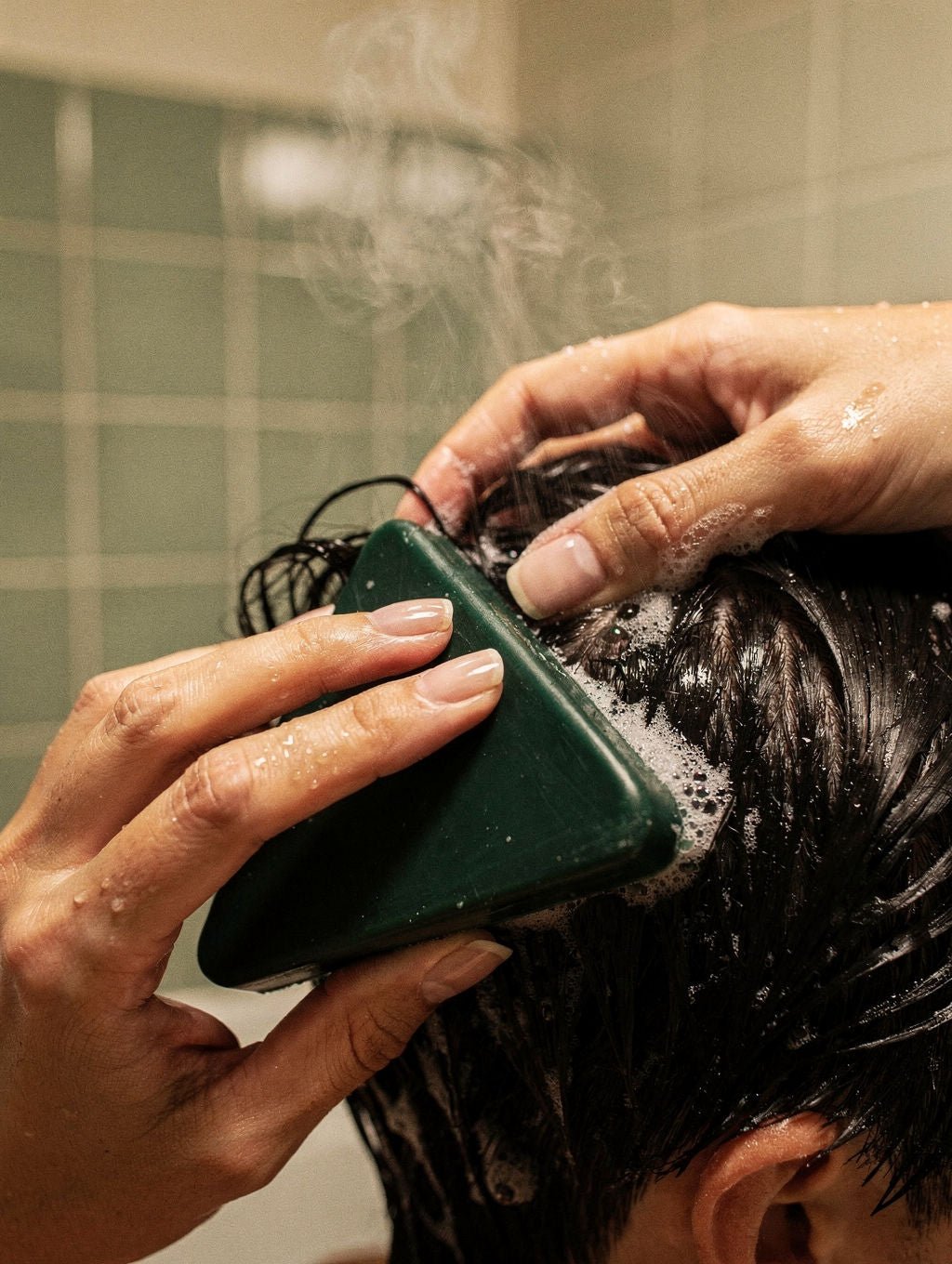 Glide the bar directly across a wet scalp
